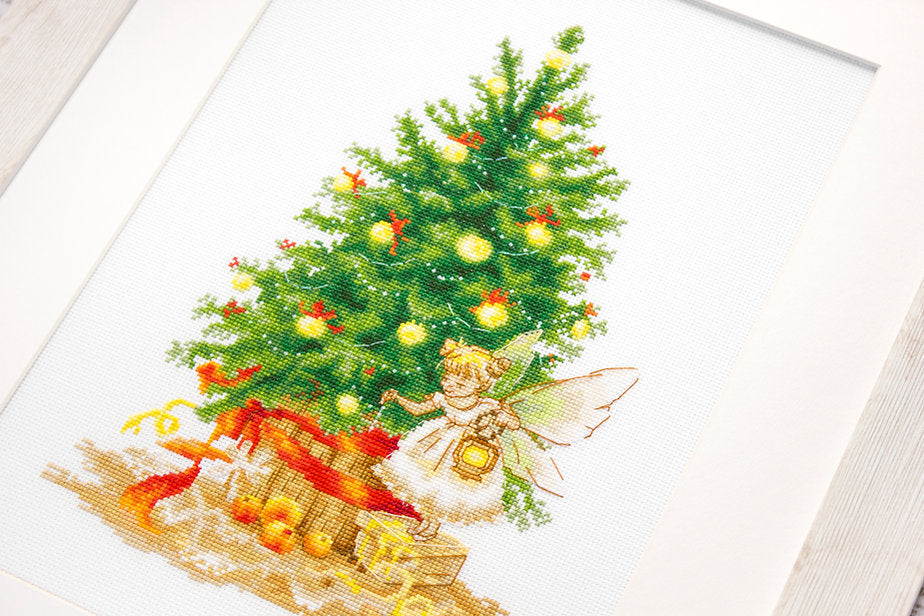 Christmas Tree B1117L Counted Cross-Stitch Kit featuring Aida canvas, colorful threads, and needle for holiday crafting.